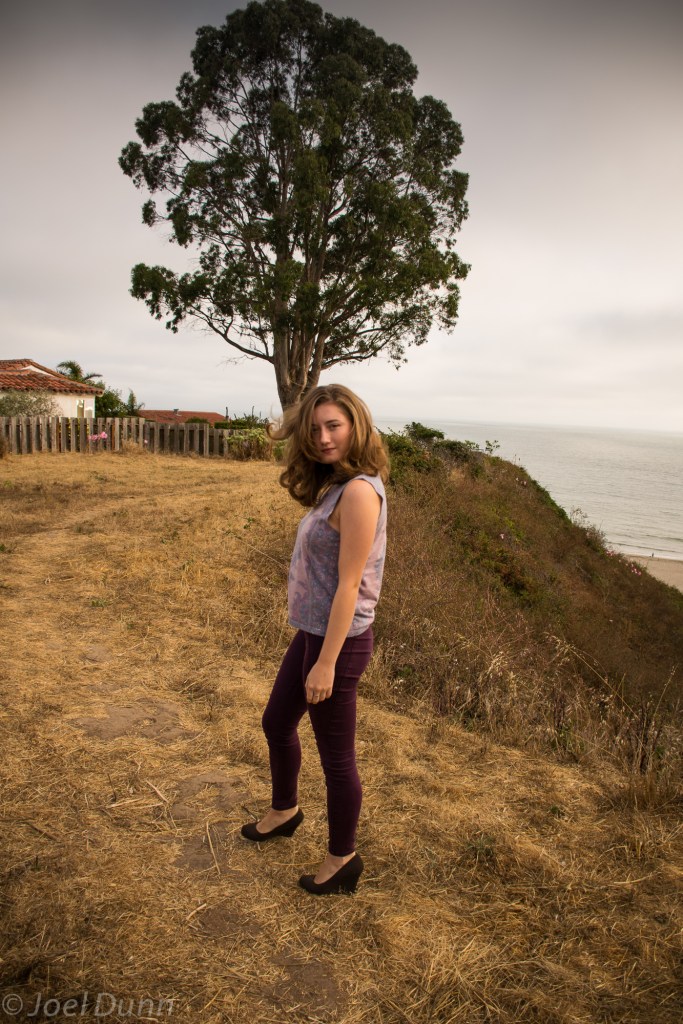 Burgundy skinny jeans, patterned tank top, wedges, gray sweater