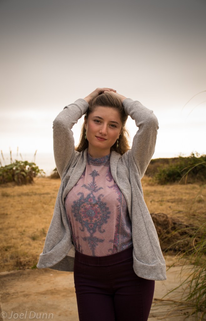Burgundy skinny jeans, patterned tank top, wedges, gray sweater