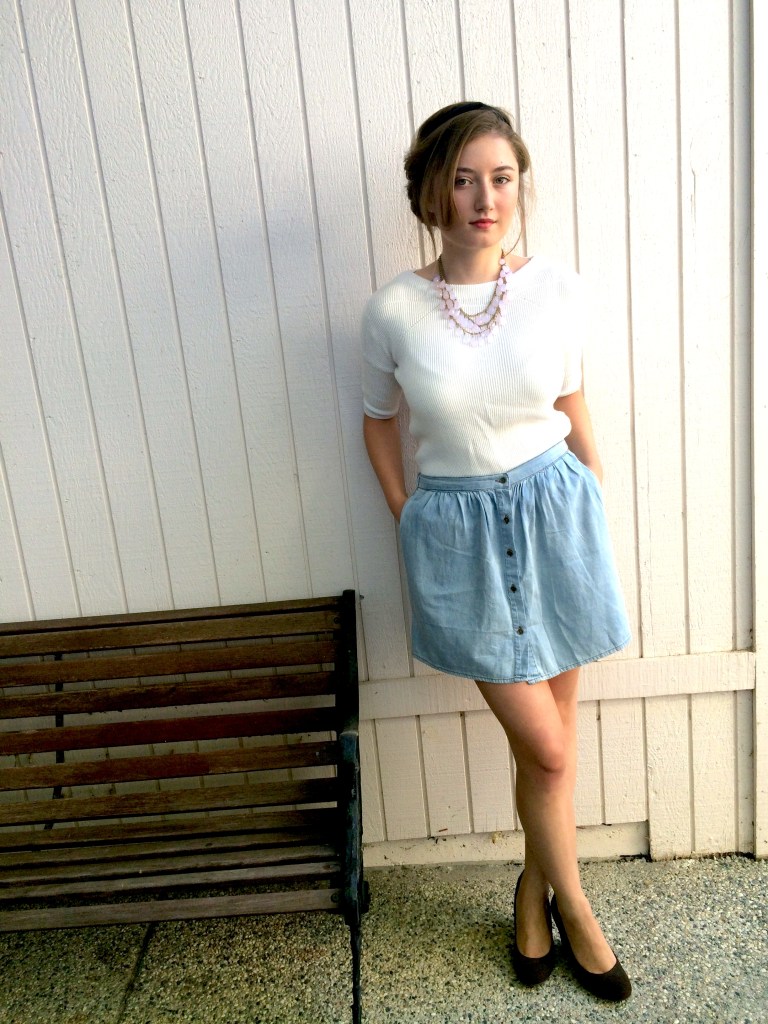 Updo hairstyle, white sweater, blue skirt, brown wedges, pink necklace