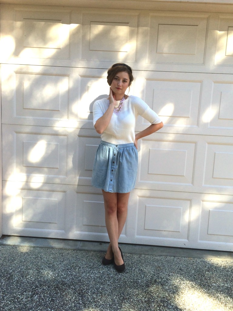 Updo hairstyle, white sweater, blue skirt, brown wedges, pink necklace