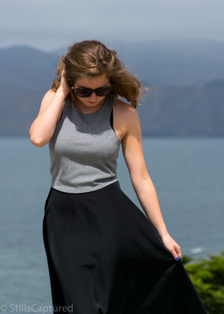 Black and White striped crop top, Black high wasted long skirt, Black Strappy Heels, Big Sunglasses, Wavy Hair