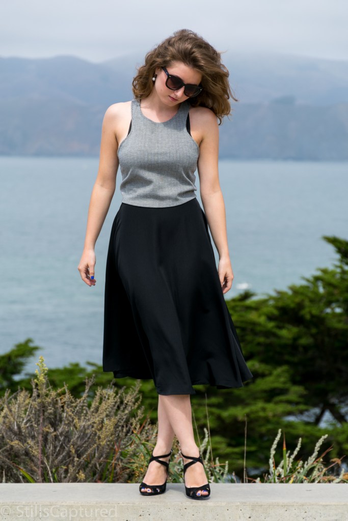 Black and White striped crop top, Black high wasted long skirt, Black Strappy Heels, Big Sunglasses, Wavy Hair