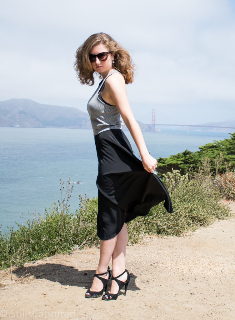 Black and White striped crop top, Black high wasted long skirt, Black Strappy Heels, Big Sunglasses, Wavy Hair