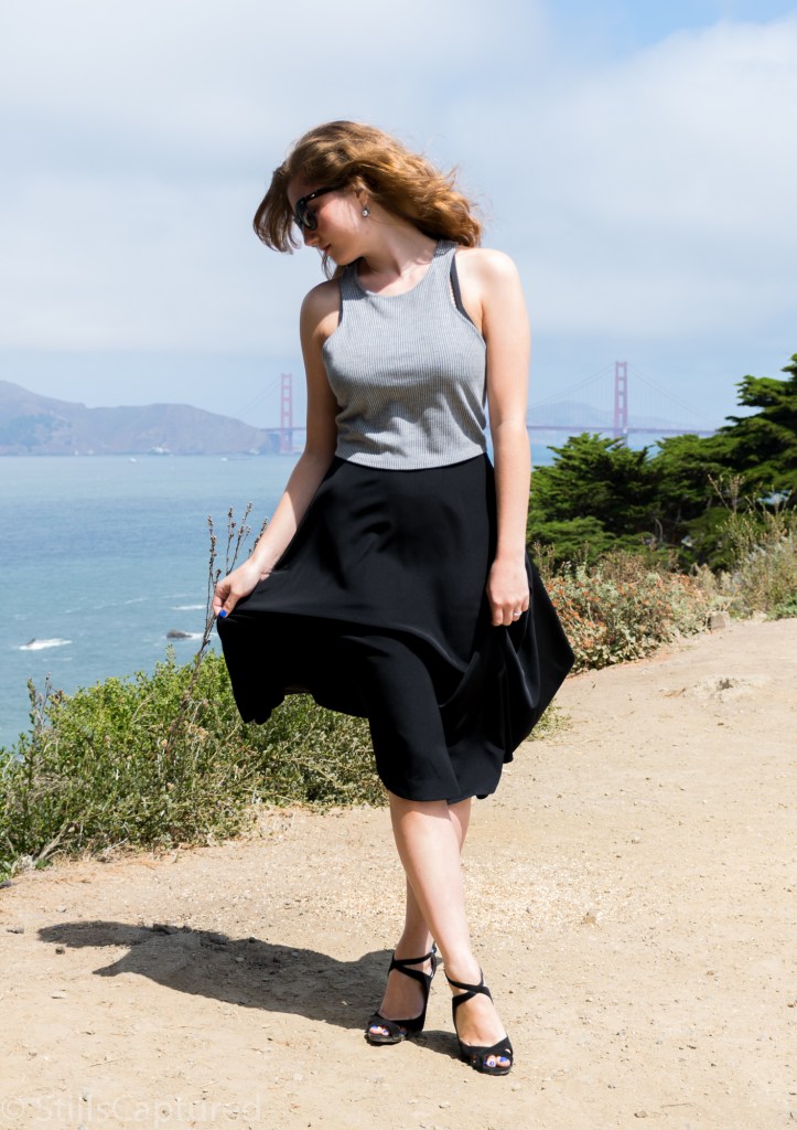 Black and White striped crop top, Black high wasted long skirt, Black Strappy Heels, Big Sunglasses, Wavy Hair