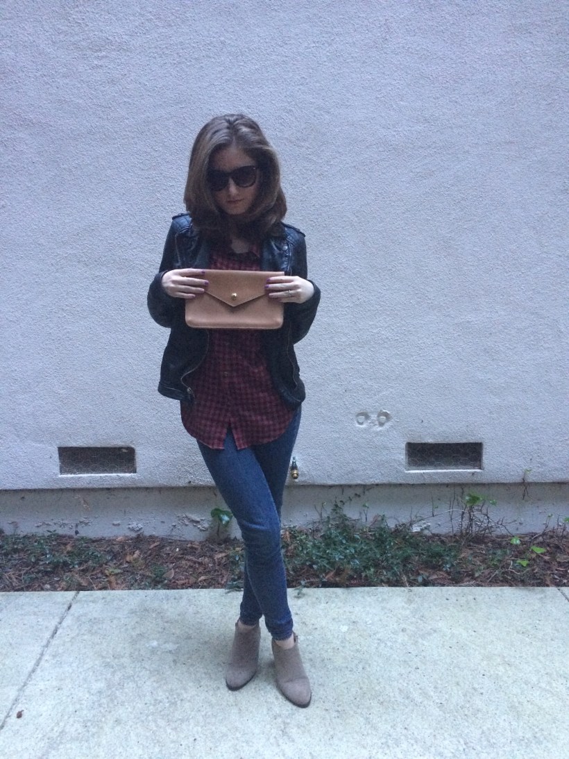 Leather clutch, leather jacket, flannel, skinny jeans, booties