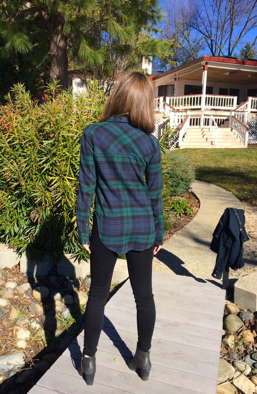 blue and green flannel, black jeans, booties