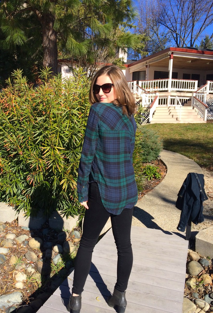 blue and green flannel, black jeans, booties