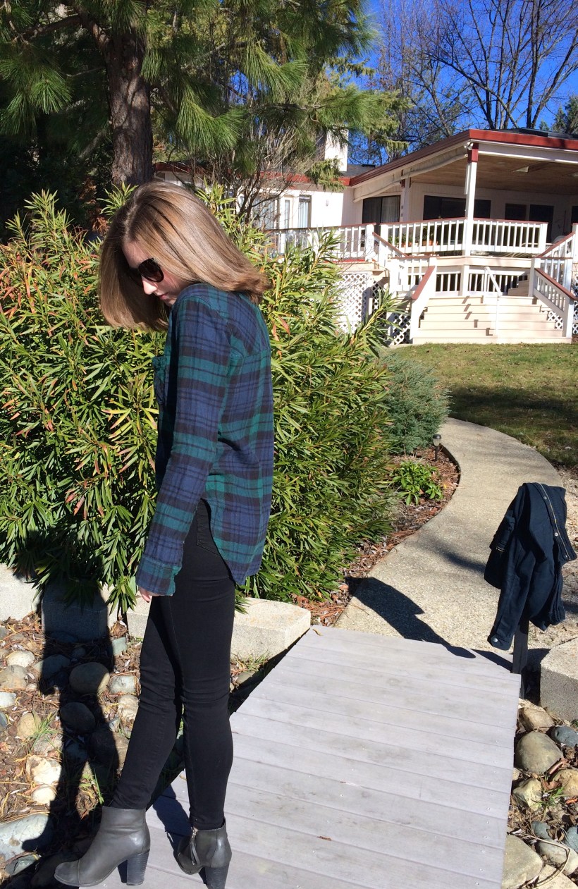 blue and green flannel, black jeans, booties