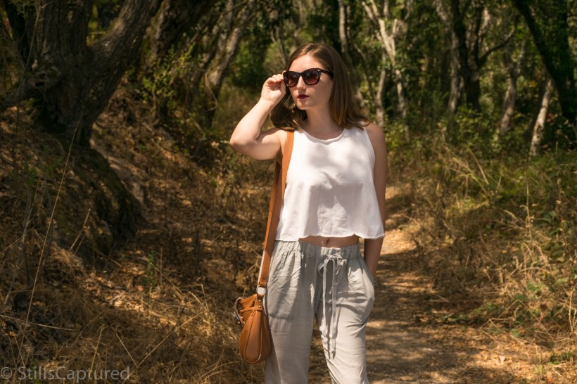 Urban Outfitters loose fitting tank top and pants, cross body purse, nordstrom sunnies, wedge pumps 